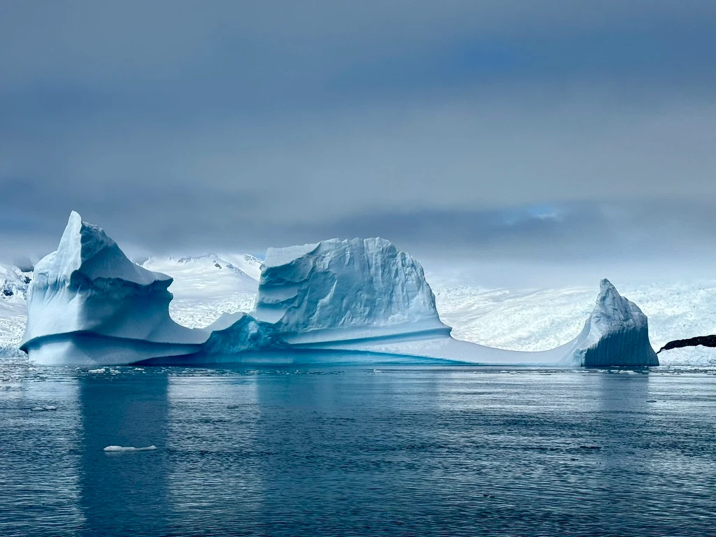 Blue sculptural icebergs in Antarctica