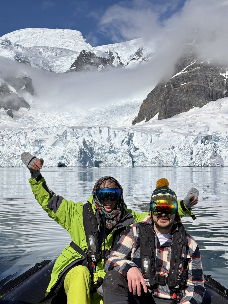 Justin on the right and Brian on the left in a Zodiac in Antarctica