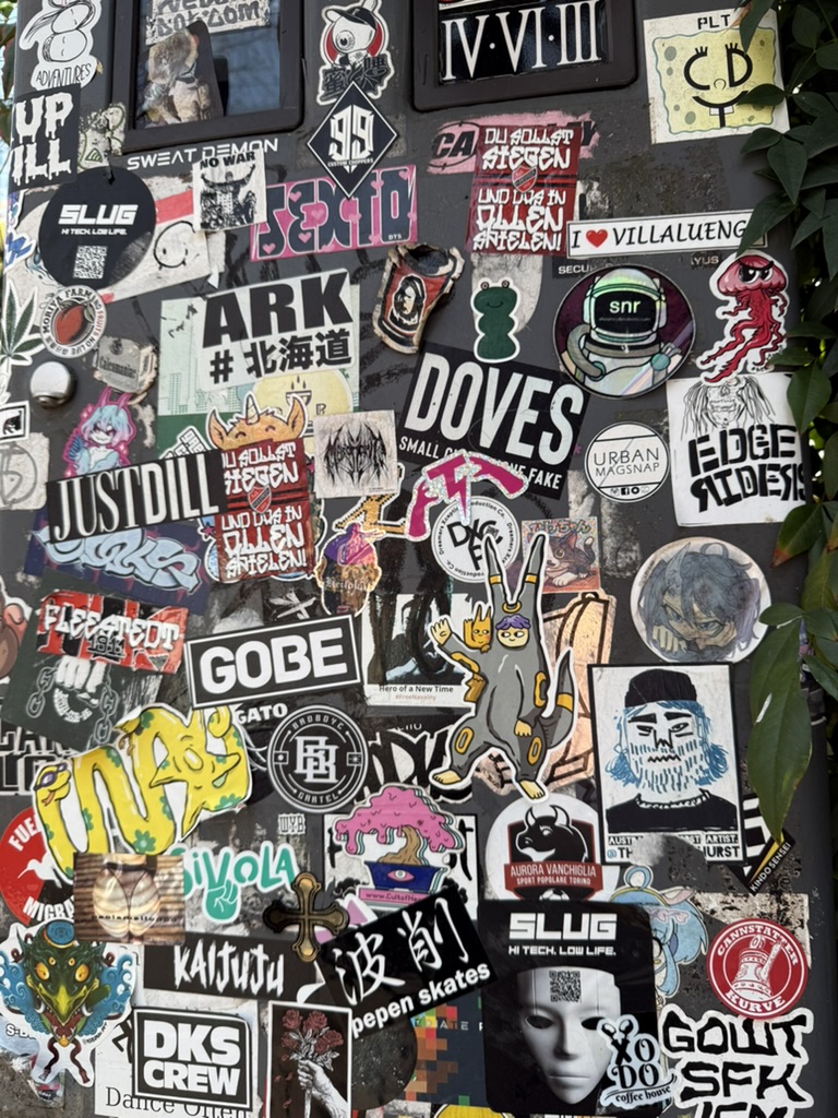 A door layered with colorful stickers